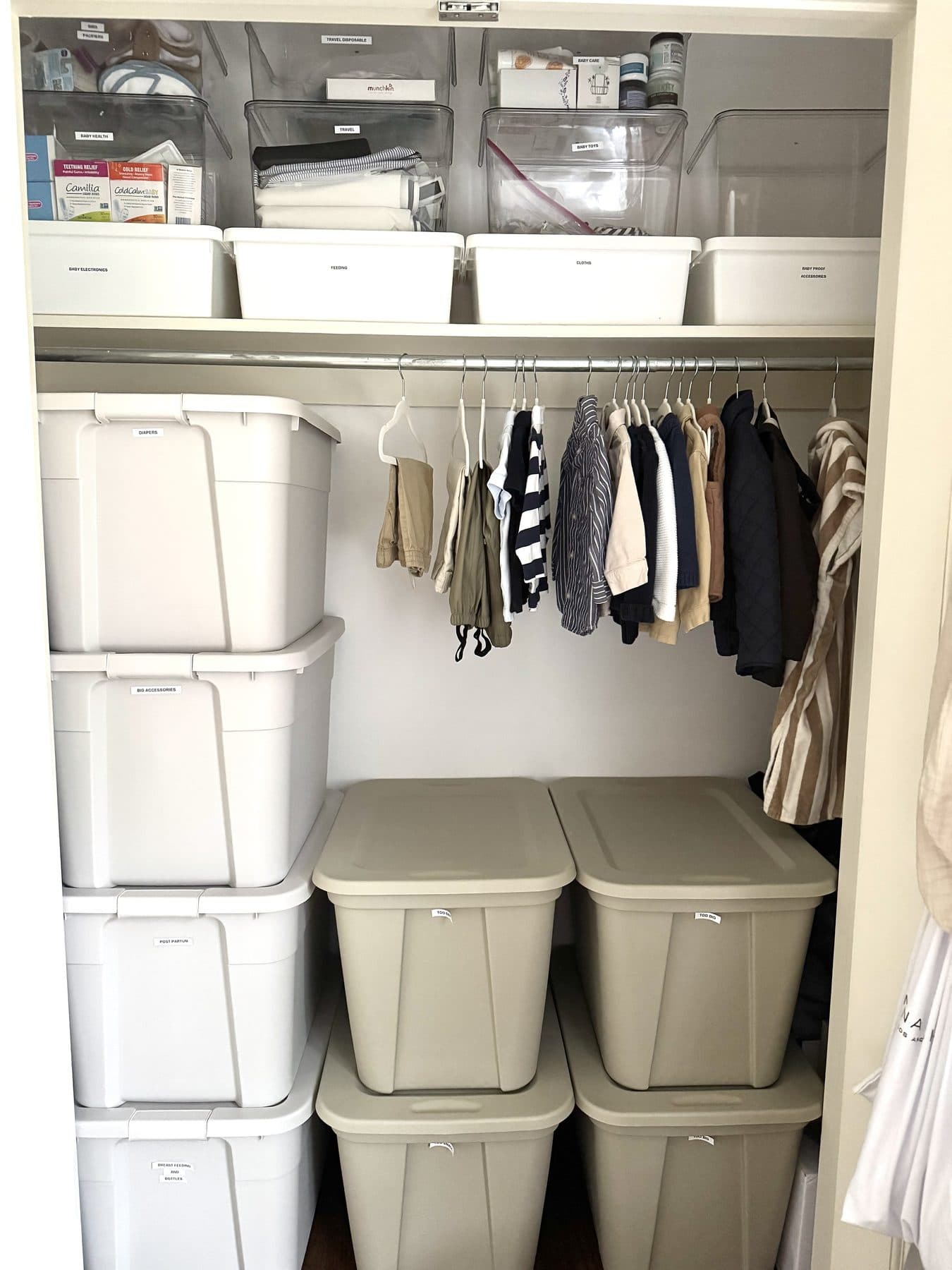 Baby closet with matching labeled bins after an IZEN organizing session