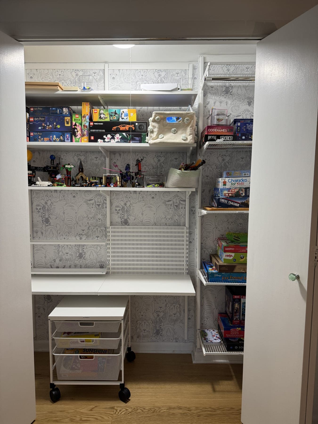 Toy closet with sorted games and building sets and a clear desk after an IZEN session